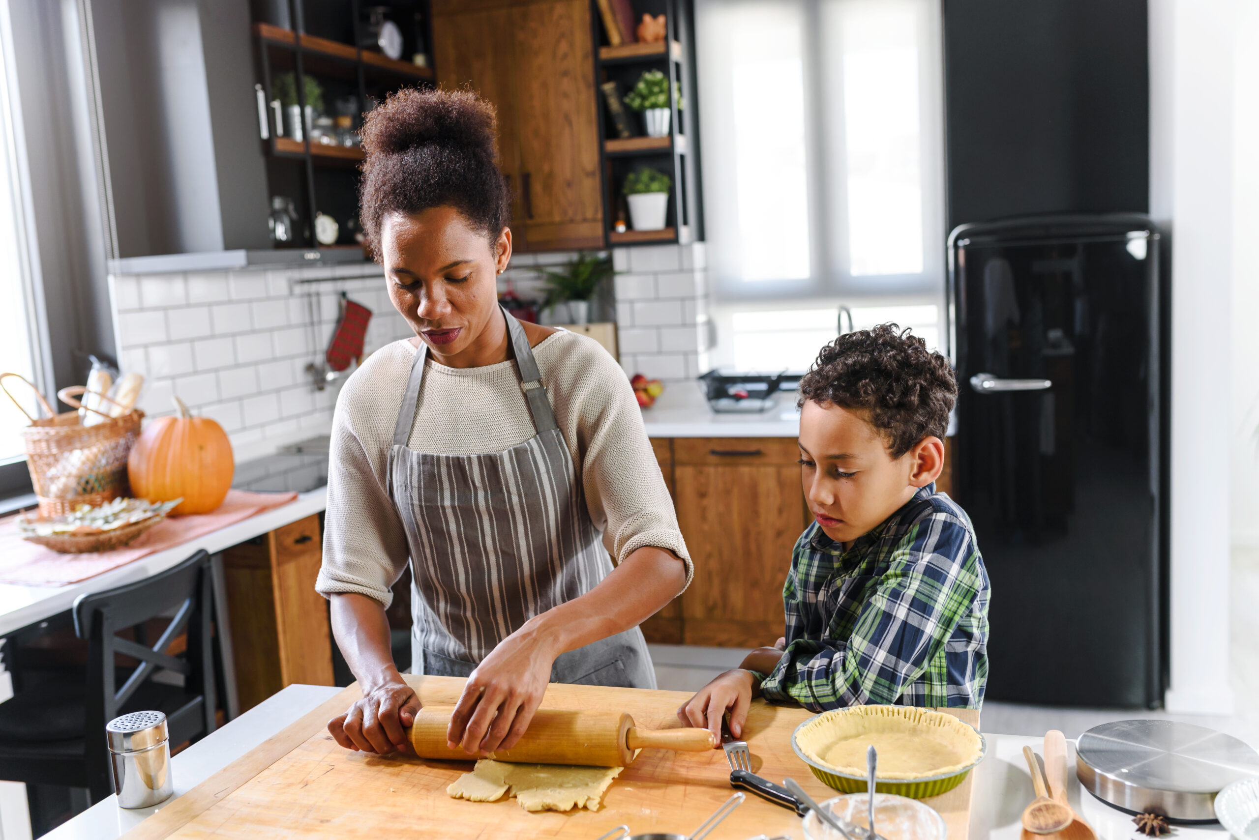 Mother and son baking together