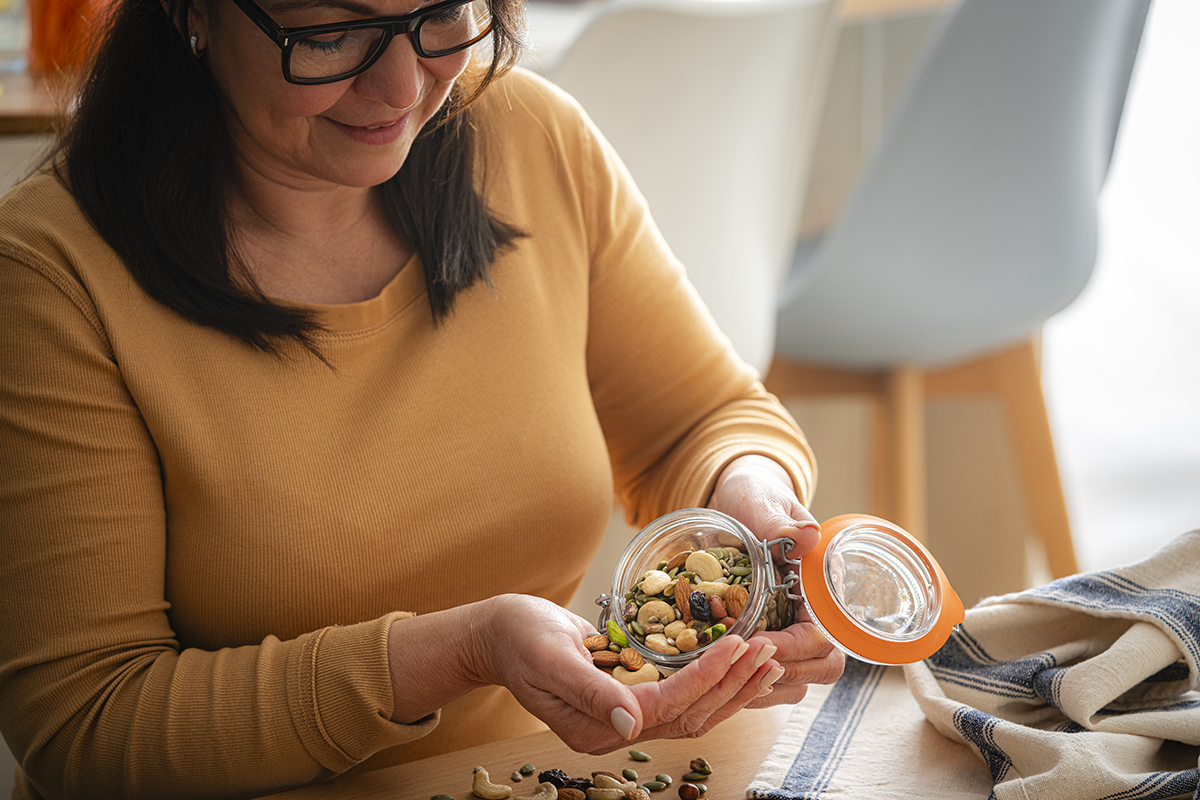 Middle-aged woman grabbing Healthy, Flavorful Snacks to Fuel Her Road to Fitness