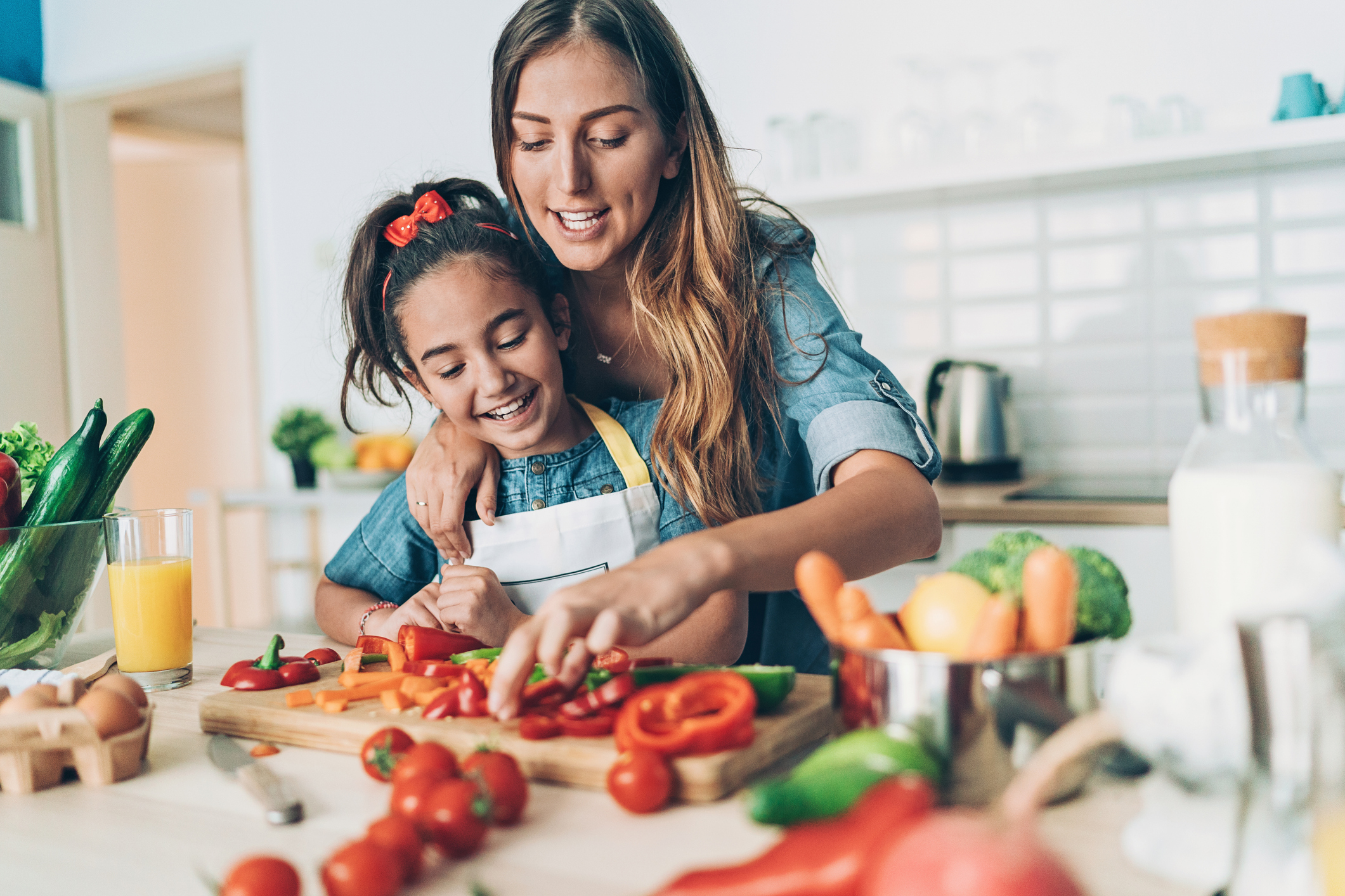 Mother and daughter cooking together